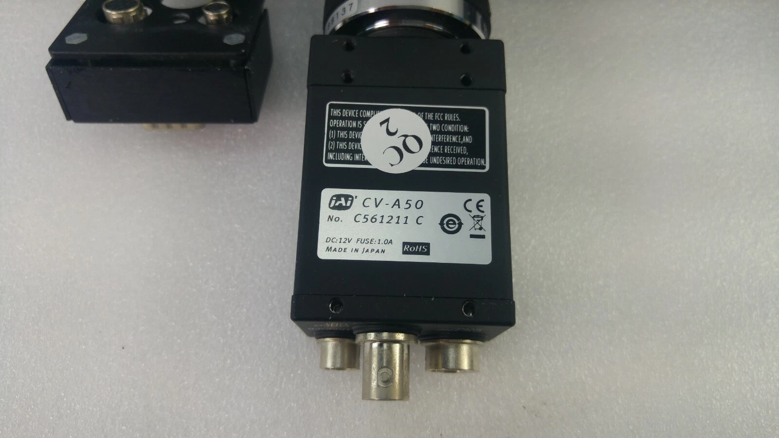 JAI CV-A50 label: No. C561211 C, DC 12V, fuse 1.0A, Made in Japan, CE, RoHS