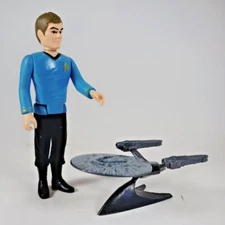 Star Trek- Dr. McCoy Figure with Metal StarShip Model on Display Stand.