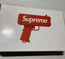 Supreme Cash Cannon 100 Authentic Money Gun WITH SUPREME MONEY