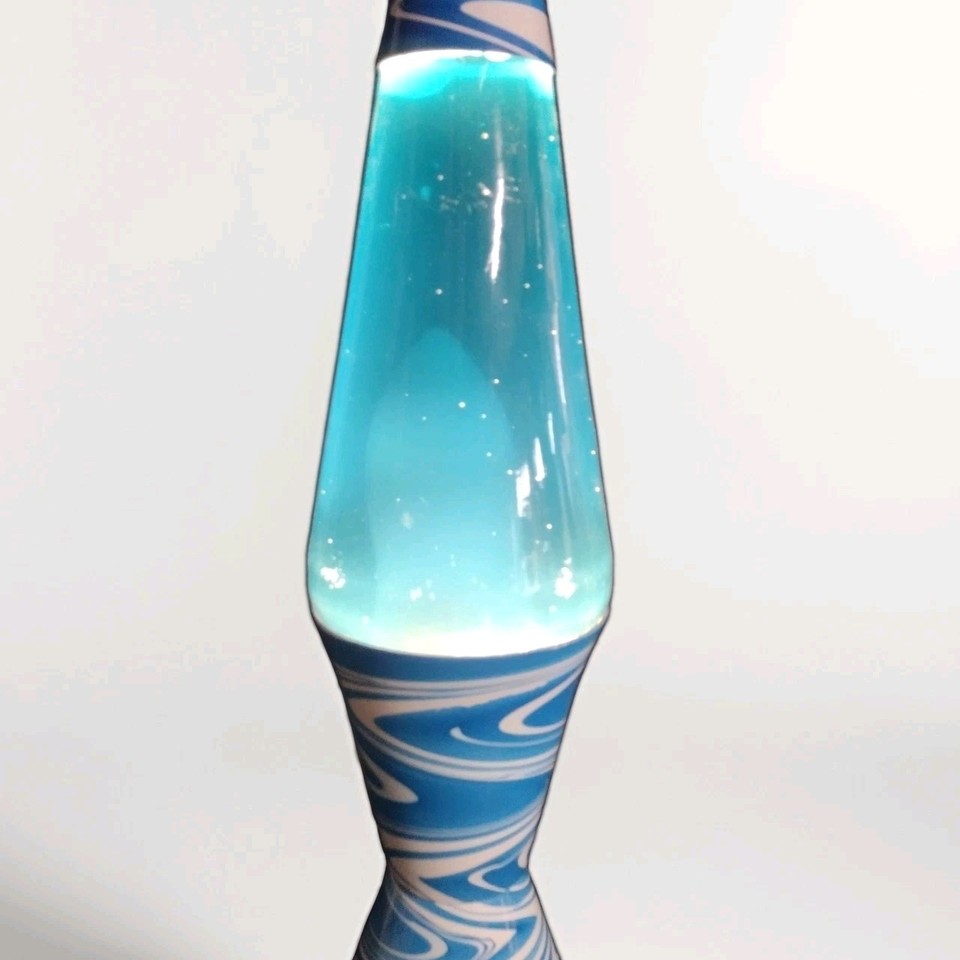 A genuine 1990s 16.5" blue-and-white lava lite lamp — an actual piece of working psychedelic nostalgia that lights up a room instantly.