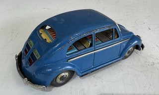 Tin Oval Window Volkswagen Bug Tin Toy Made In Japan By Nomura Toy Blue WOW…..