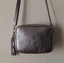 Silver real leather camera bag with matching leather adjustable strap and tassel