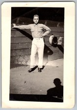 Vtg B&W Snapshot Handsome Young Man Posing By Wood Fence With Hat Hanging 1930s