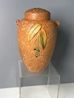 WELLER POTTERY Orange CORNISH JAR WITH LID HAS SOME DAMAGE.
