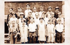 Rare RPPC Real Photo Postcard "11 Kids 1 Teacher on back stairs"