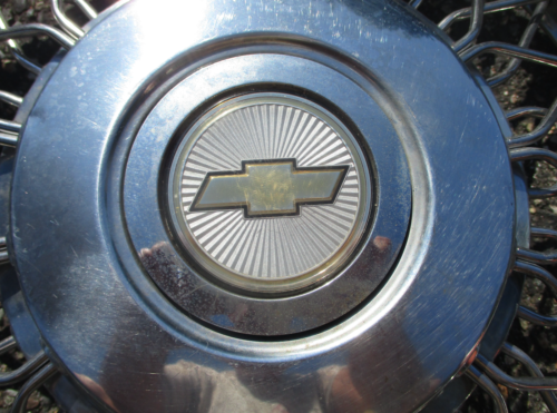 One genuine 1986 to 1990 Chevy Celebrity 14 inch wire spoke hubcap 