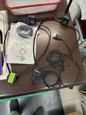 (2) Widex hearing aid programming interface features a central puck