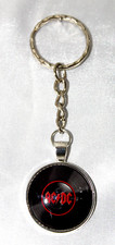 AC/DC Keyring, with silver plated holder  and glass cabochon.