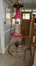 antique hanging cranberry oil lamp with smoke bell glass drop in brass chains