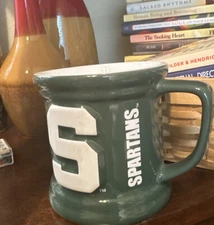 Michigan State Spartans Coffee Mug. Green w/ White Letters From The encore Group