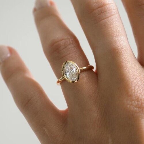 Jubiläumsring 2 kt Ovalschliff VVS1 Moissanit Lünette massiv 14 kt Gelbgold - Bild 1 von 5