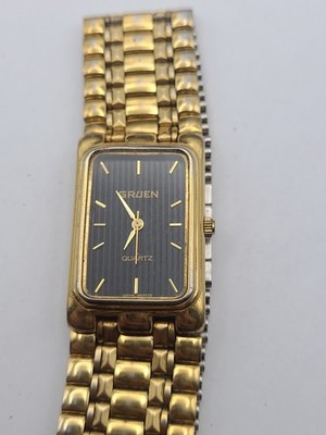 Gruen Mens 236-Y121 Dress Black Gold Dial Tone Quartz Analog Watch