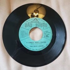 45 RPM THE BLEU LIGHTS/A LONELY MAN'S PRAYER/BONY MORONIE   BAY SOUND 67007 VG++
