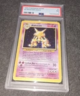 Pokemon Alakazam Base Set Unlimited Holo Rare #1 PSA 7