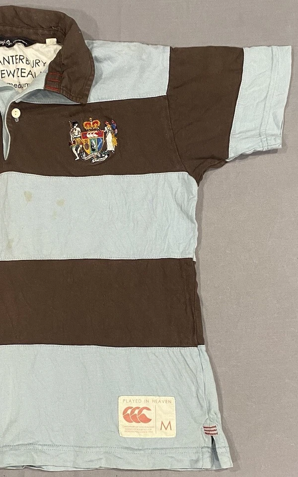 Polo de Rugby Canterbury of New Zealand Niños M Azul Marrón Rayas Jugado en el Cielo Foto 2 de 4