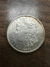 1885 O Morgan Silver Dollar. Estimated Uncirculated Mint State 63. Video M0029.