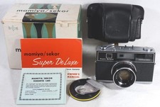 MAMIYA/Sekor Super Deluxe Camera with Kominar 1:2 f=48 mm Lens, Manual, and Case