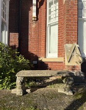 A Weathered Composite Stone Garden Bench with Lions Mask Bases, 112cm wide