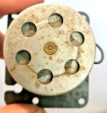 Unbranded Untested Clock Motor piece on base firmly based in past time