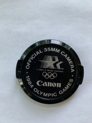 Capuchon d'objectif avant commémoratif Canon 52 mm authentique des Jeux olympiques d'été 1984 - Photo 1/2