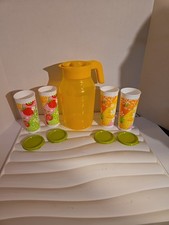 A Tupperware 3 L Pitcher With 4 ml Tumbers And Seals