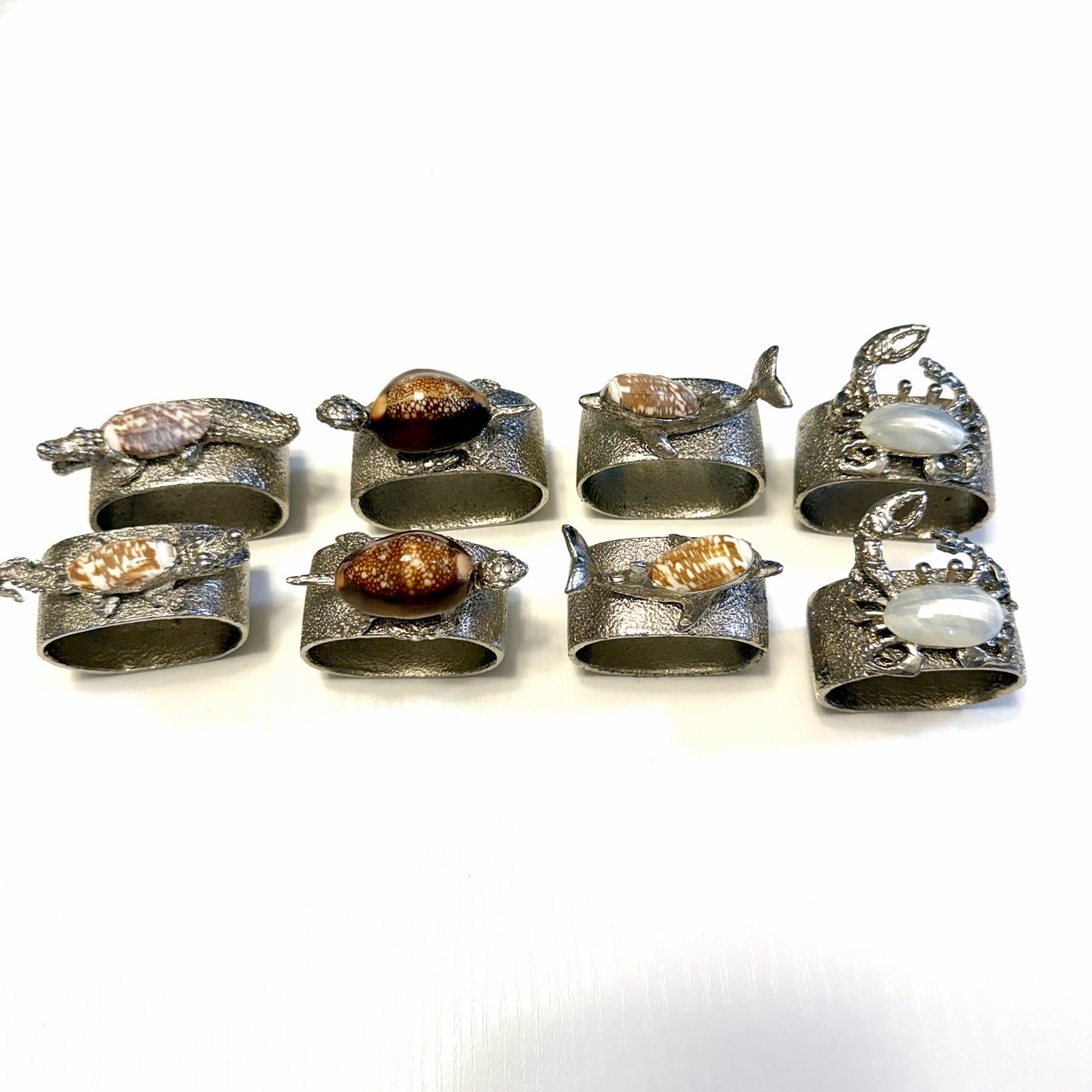 Lote de 8 servilleteros costeros cangrejo dolohin cocodrilo tortuga marina metal plateado
