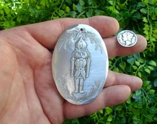 Vintage 1998 WENDELL AUGUST - oval NUTCRACKER aluminum metal Christmas ORNAMENT