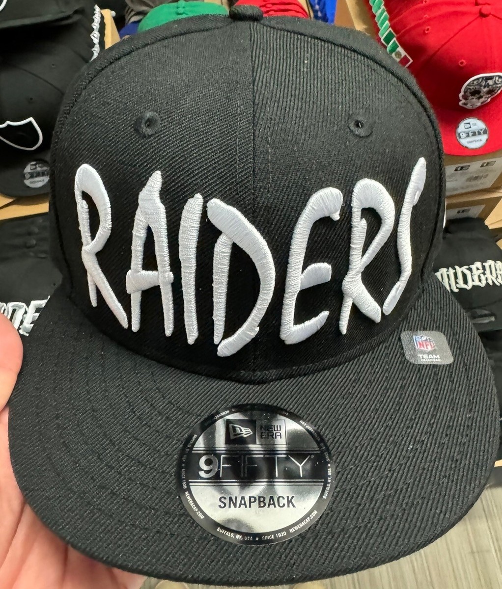 New Era Las Vegas Raiders Black SnapBack Hat Crucifix Graffiti