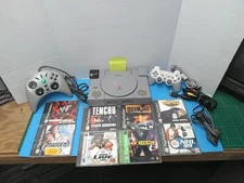 PS1 PlayStation 1  System console with 2 controllers 8 games