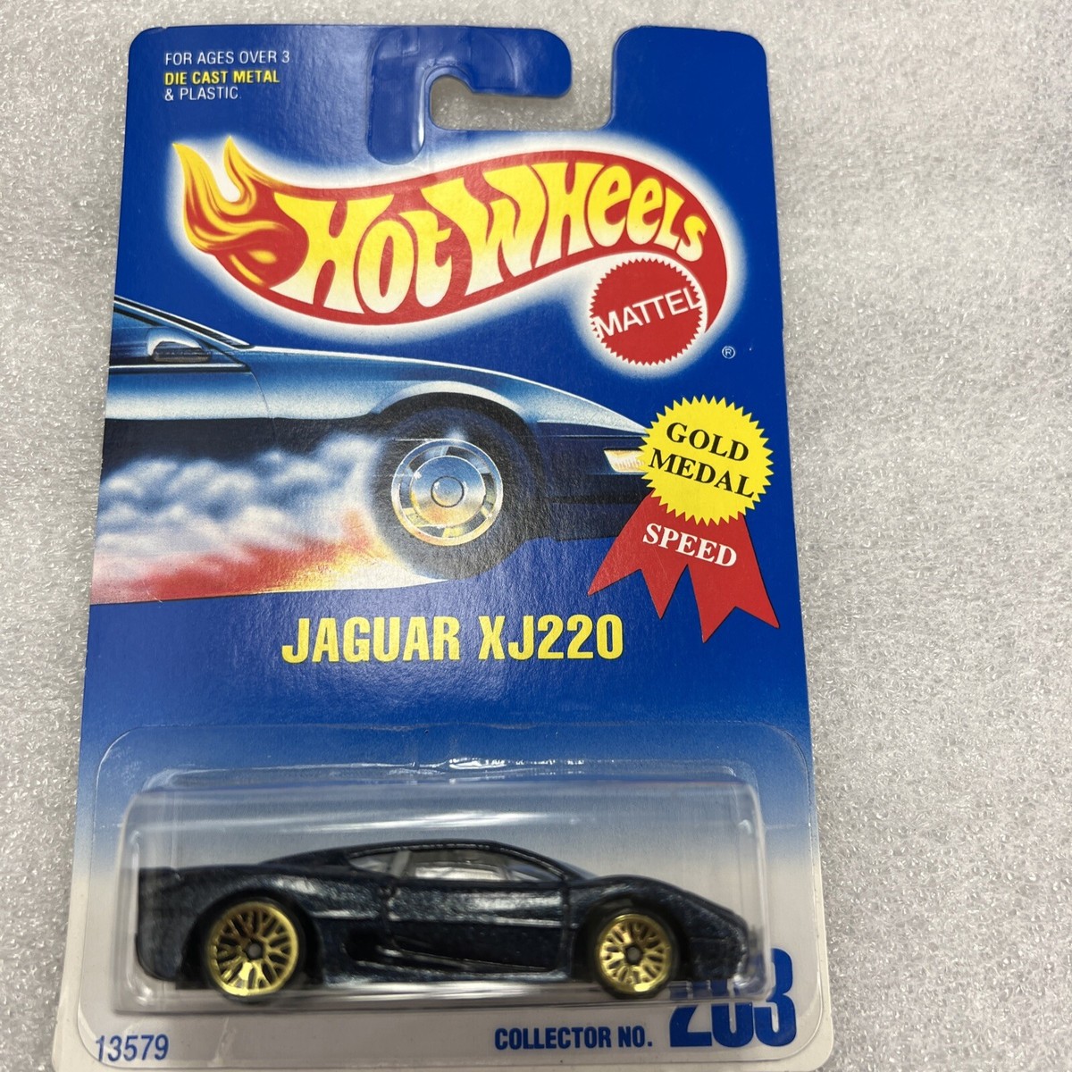 Hot Wheels # 203 Jaguar XJ220 - Dark Blue, Gold Lace -Blue/White