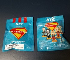 KFC Supergirl Lot Of 2 Mystery Bags Figurine Bag Clip Toy Sealed Promo