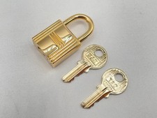 HERMES Cadena Lock Charm Gold Metal with 2 Keys Number 110 Pre-owned