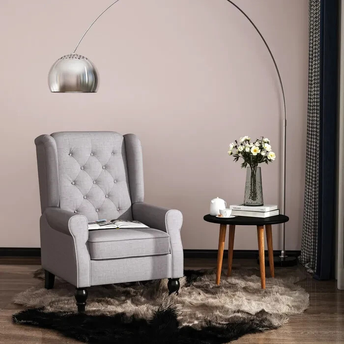 Fauteuil de salon haut de gamme capitonné avec piètement chêne