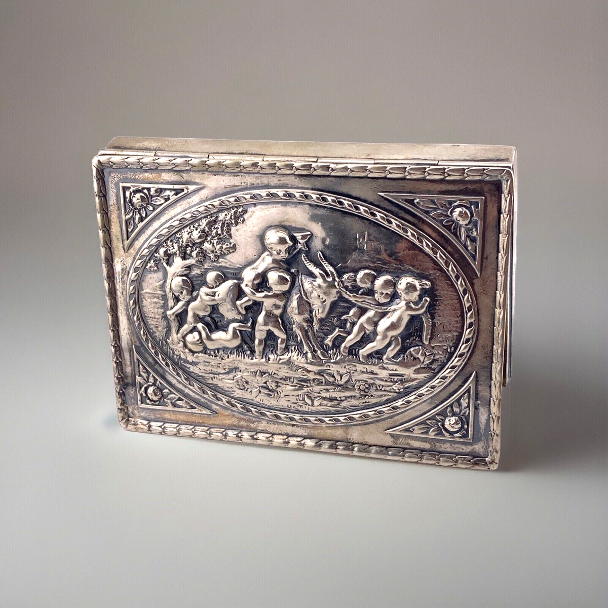 silver cigarette box with hinged lid Antique German Hanau 800 Silver Hinged Top Card Cigarette Box Cupids Cherubs