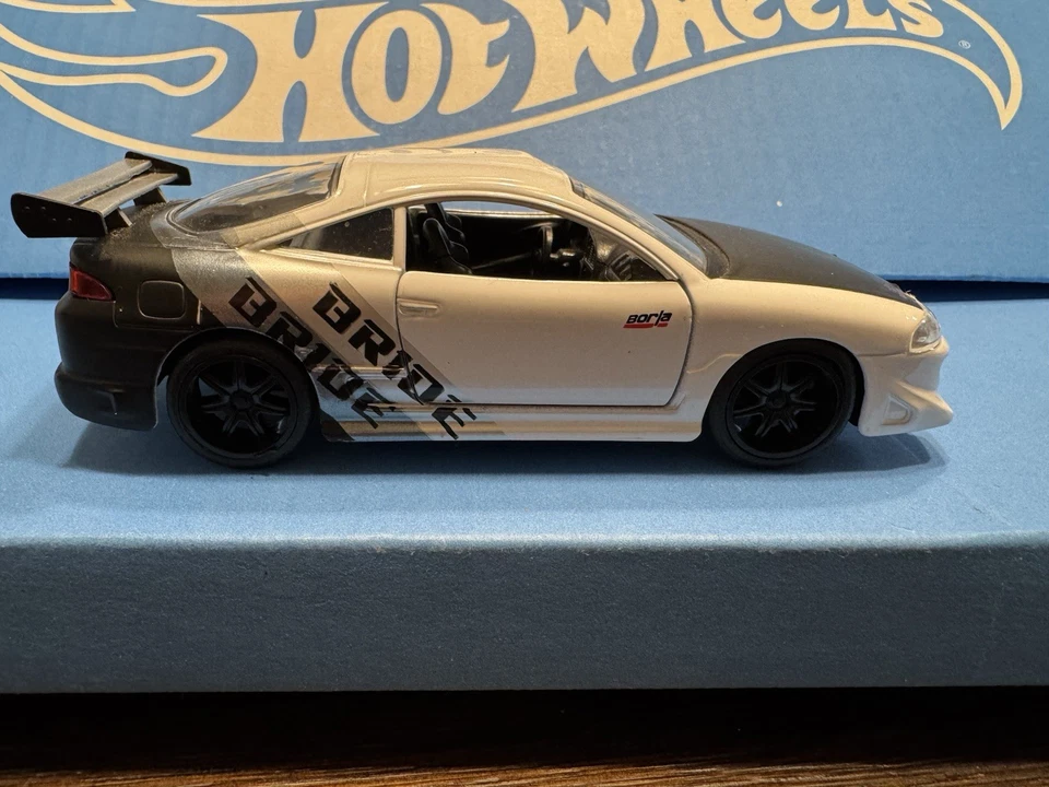 Coche diecast Jada Toys 1995 Mitsubishi Eclipse escala 1/32 blanco y negro Foto 2 de 4