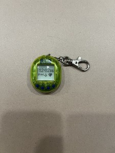 Vintage 1997 Nano Baby Virtual Pal Pet Playmates Translucent Green Keychain Toy