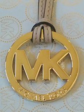 NEW MICHAEL KORS LARGE 2  GOLD MK LOGO CHARM BEIGE LEATHER STRAP HANDBAG FOB