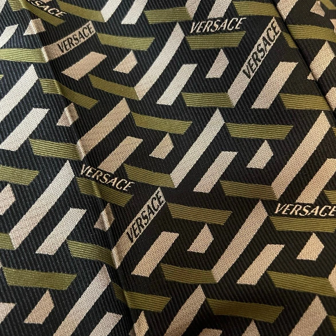 Pantalone jacquard Versace nero e kaki monogramma nuovo con etichetta taglia 42 M