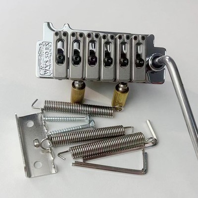 Wilkinson WVS50IIK guitar tremolo bridge with matching satin saddle.