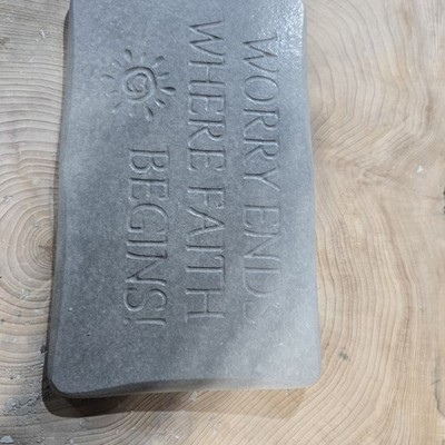 Hand Made Cement Sign That Says Worry Ends Where Faith Begins