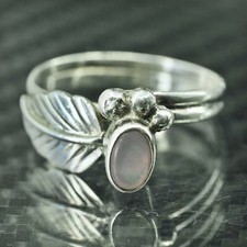 Size 7, southwestern sterling silver 925 ring with mother of pearl and feather