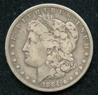 " Scarce Date" 1884-CC Morgan Silver Dollar $1 - VG w/ Rim Bump