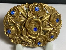 LOVELY VINTAGE EARLY MOLDED PLASTIC SASH PIN OR BROOCH W/BLUE RHINESTONES 