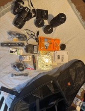 Black Nikon d3300 dslr starter bundle with backpack carrier