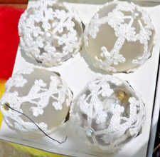 Crocheted Covers onr the 4 beautiful Ornaments.