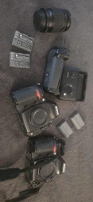 2 Nikon D700 Digital Camera bodies with 2 Lenses, Batteries, and Battery Grip