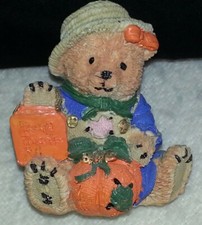Teddy sitting in a pumpkin patch. Resin figurine. "Pumkin Patch Teddy" 1998