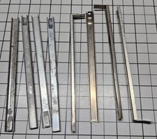 A.C. Gilbert Erector "MW" Nut Holders,  Lot of 8, 3 with and 5 without Tab