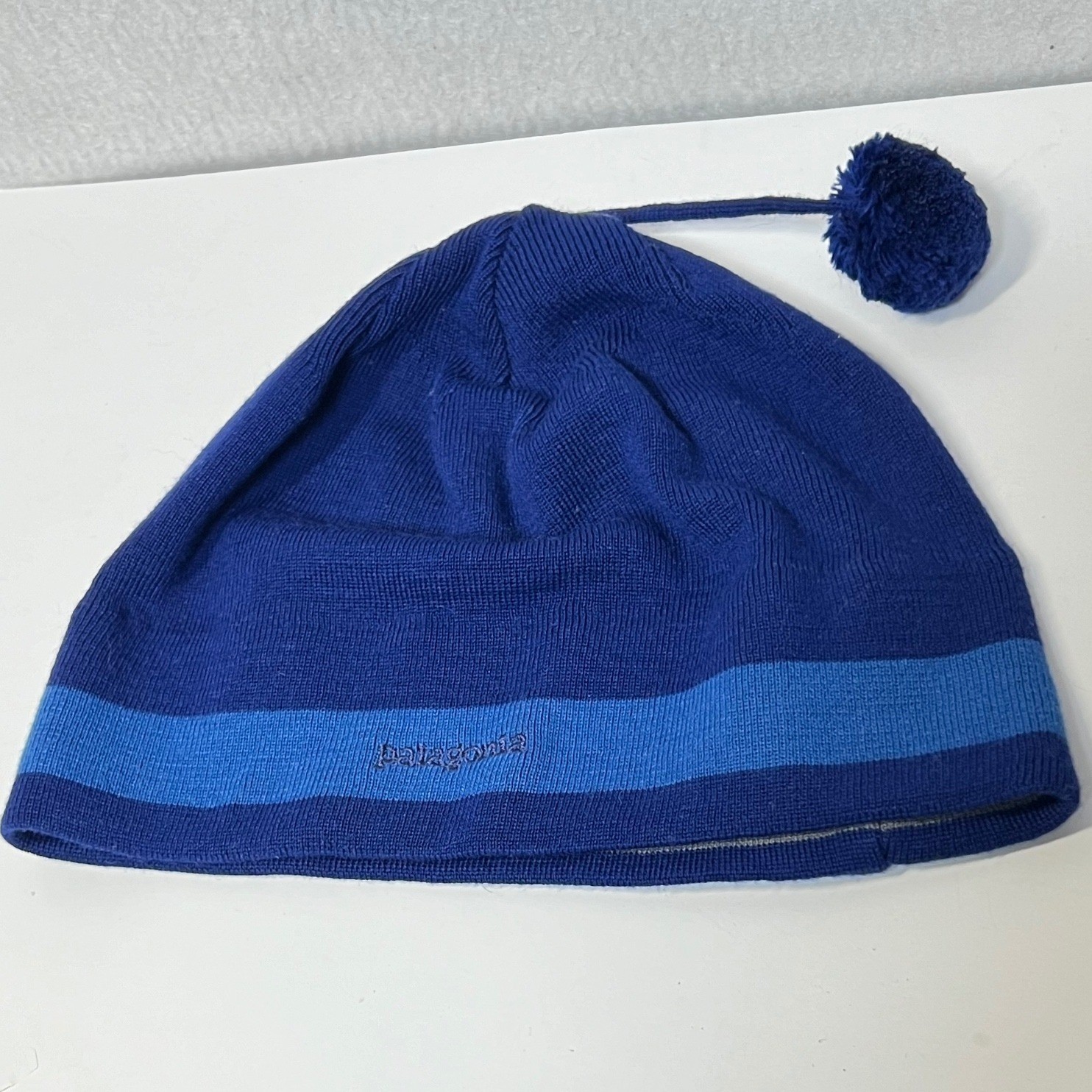 VTG Patagonia Blue S Beanie Hat Knit Size L Made in France Wool Blend Tassel