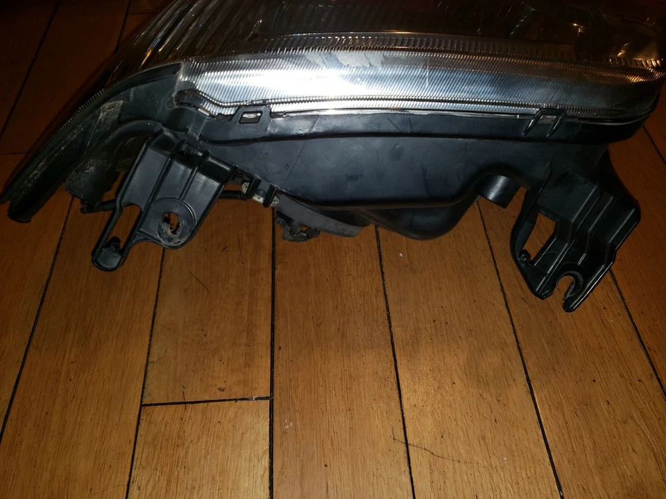 Faro halógeno izquierdo fabricante de equipos originales Mercury Mariner 2005 2006 2007 Foto 3 de 3